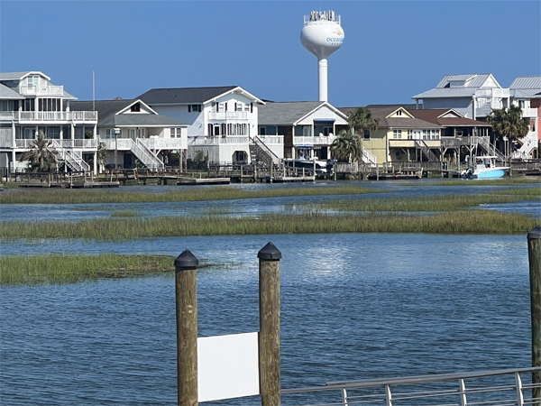 Ocean Isle water tower and houses