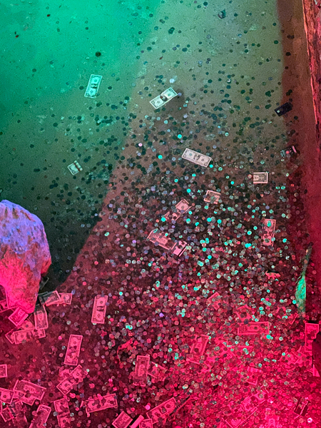 dollar bills in the wishing well