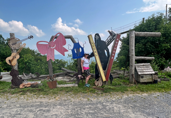 Karen Duquette and Bigfoot at the Love sign