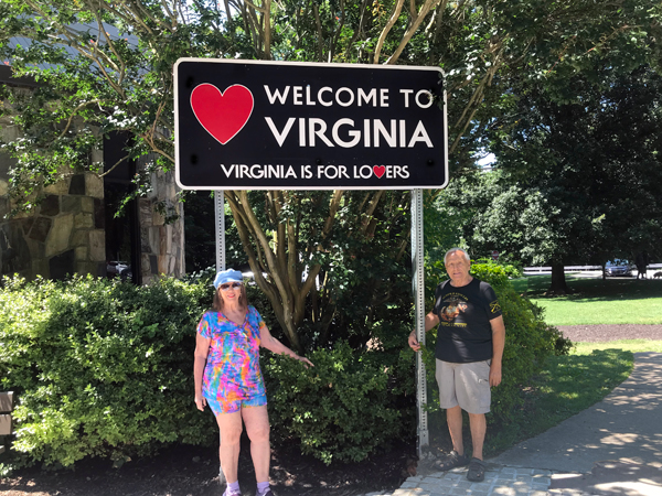 The two RV Gypsies at the Welcome to Virginia sign