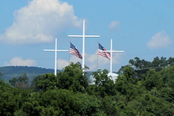 three Crosses and two USA flags