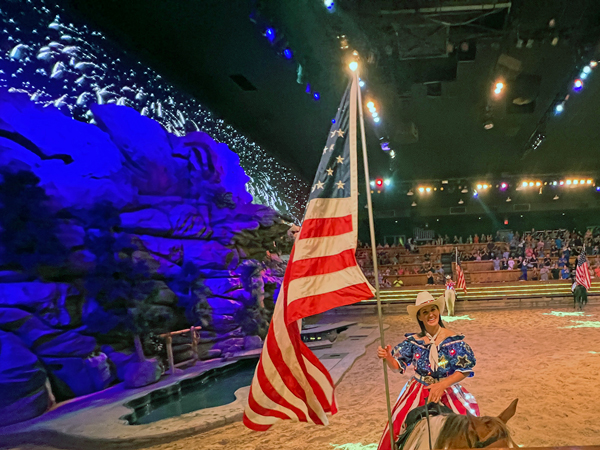 cowgirl and USA flag