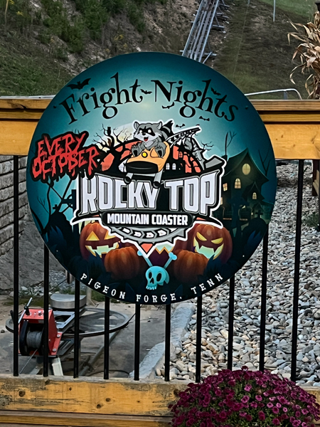 Rocky Top Mountain Coaste sign at night