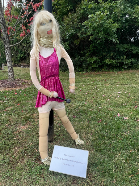 girl in pink scarecrow