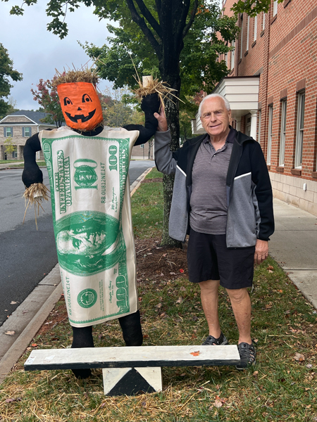 Lee Duquette and a money scarecrow