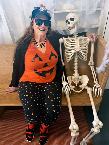 Karen Duquett and a skeleon