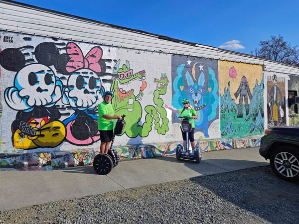 The two RV gypsies near a mural