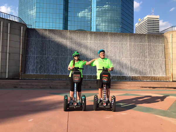 The two RV Gypsies Freewheeling at the waterfall on Segways