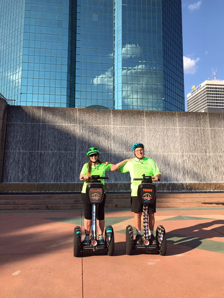 The two RV Gypsies Freewheeling at the waterfall on Segways