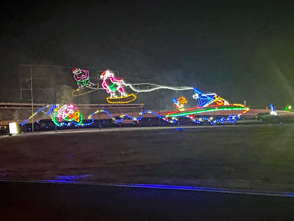 Santa Claus water skiing behind a boat