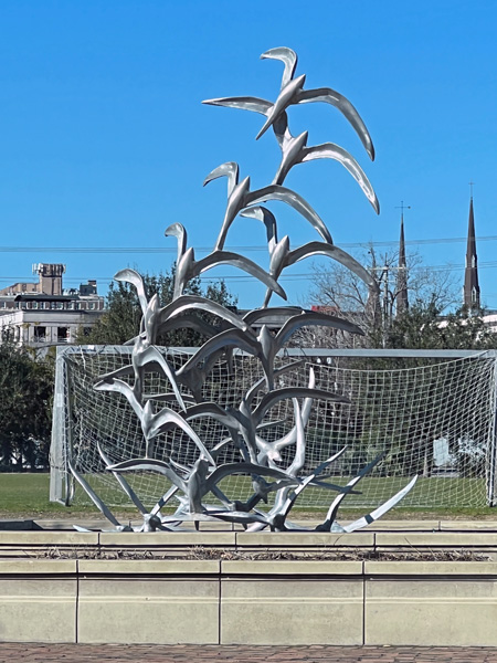 a metal brid statue