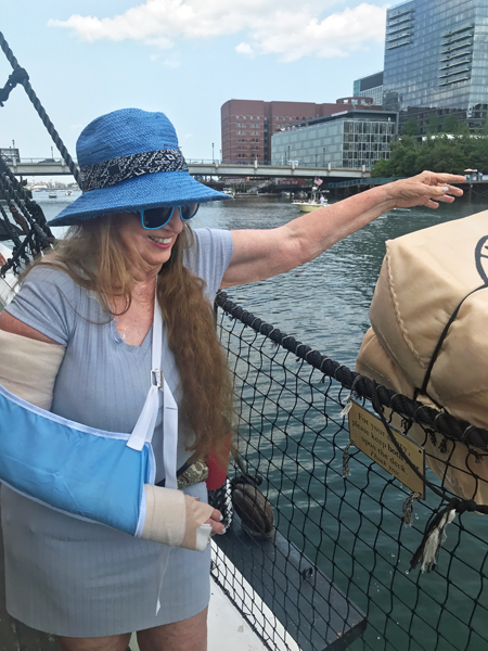 Karen Duquette throwing tea overboard