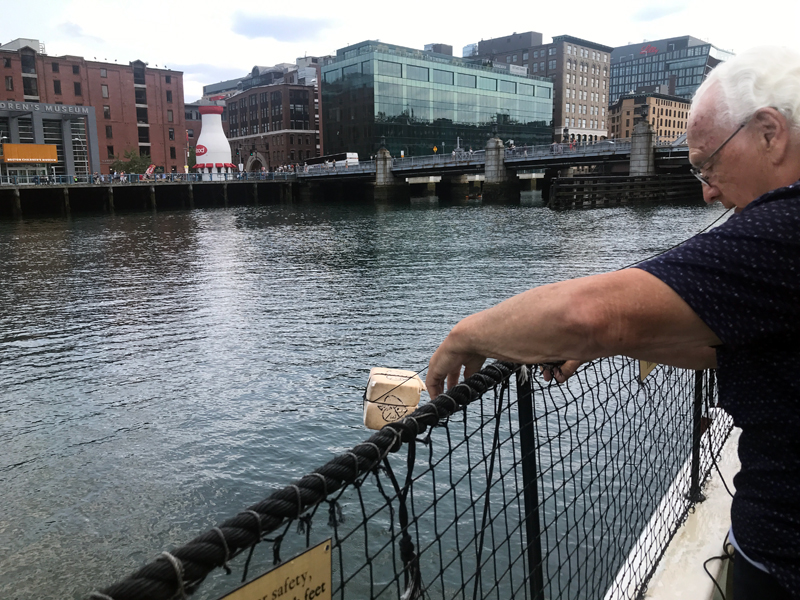 Lee Duquette throwing tea overboard