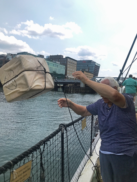 Lee Duquette throwing tea overboard