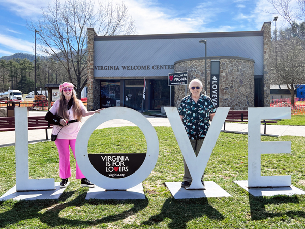 Karen and Lee Duquette at the Virginia Love sign