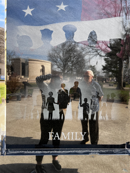 Karen and Lee Duquette's reflection in a photo