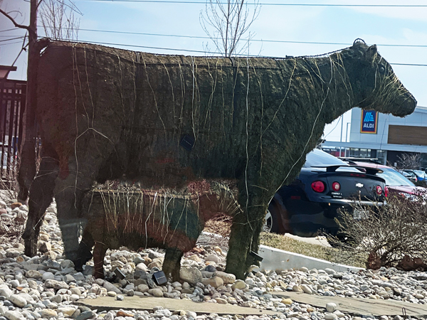 A statue of cow and its calf