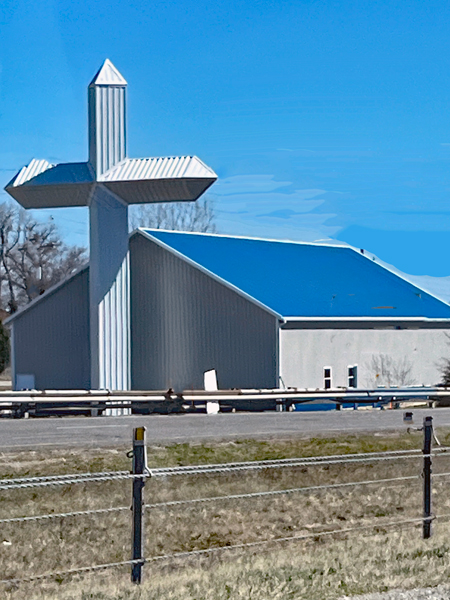 big cross by a building