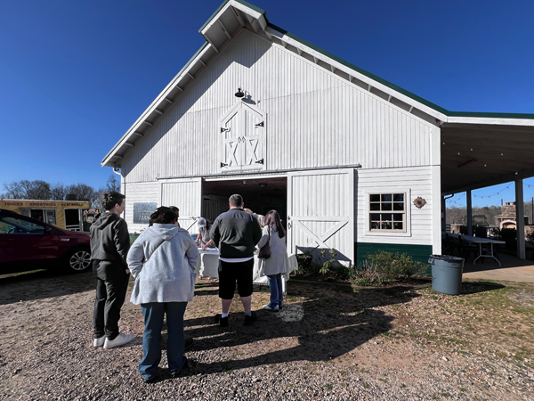 family paying their entry fees