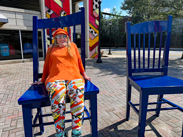 Karen Duquette in a giant chair