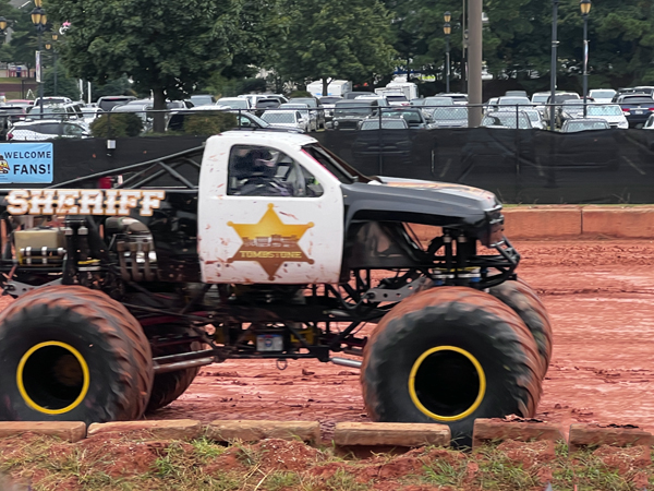 Ricky Fowler in the Sheriff Monster Truck