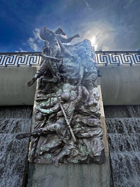 20-foot-tall bronze relief wall as defined above.
