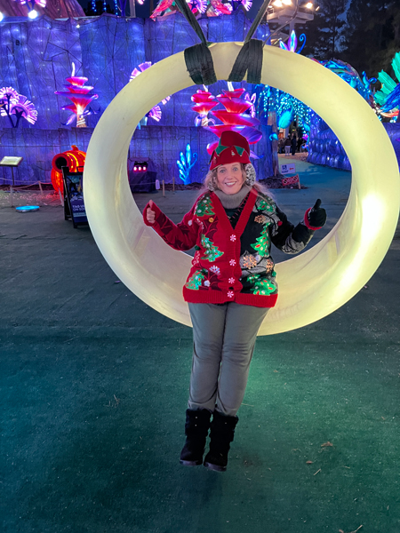 Karen Duquette on a  yellow swing