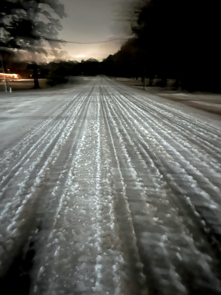 icy road after a few cars drove on it