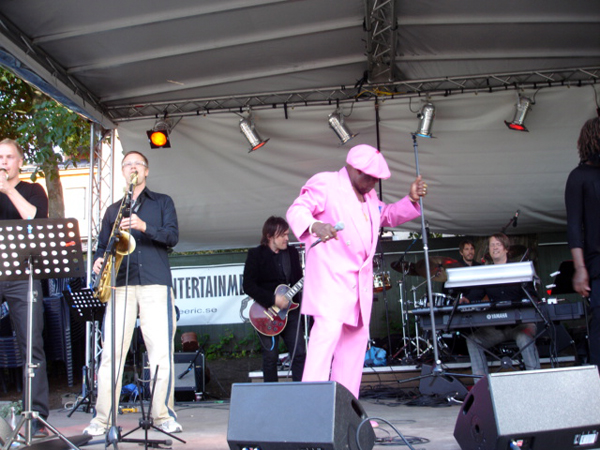 singer in a pink suit