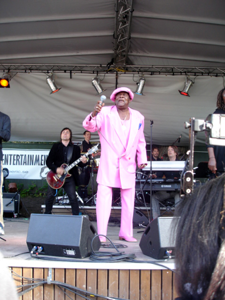 singer in a pink suit