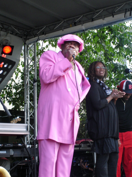 singer in a pink suit