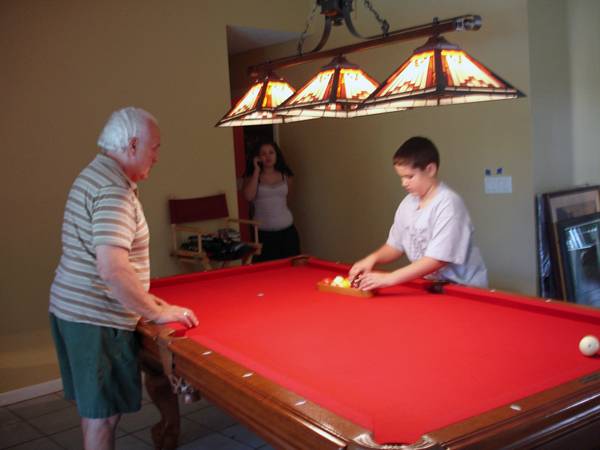Lee Duquette taught his grandson Alex how to play pool.