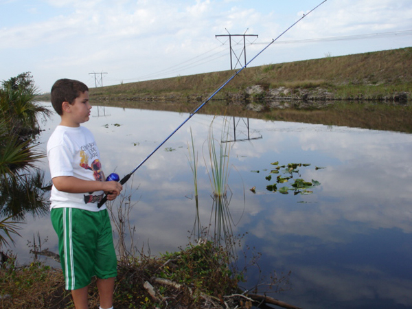 Alex enjoying fishing time at Markham Park