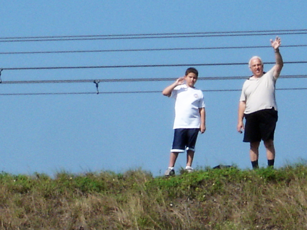 Lee Duquette and his grandson on the berm