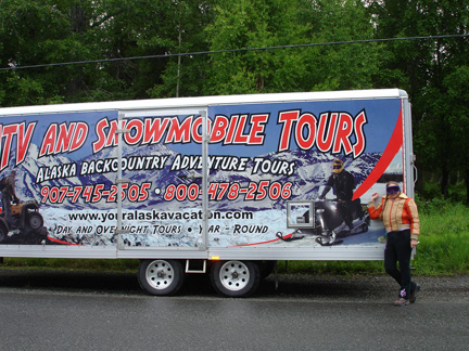 Karen Duquette and the truck holding the ATV's