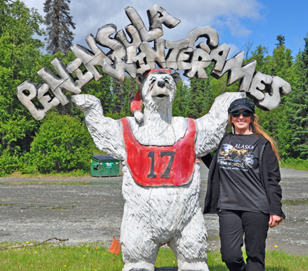 Karen Duquette and a bear statue