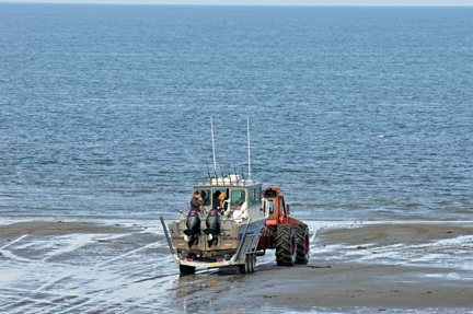 boat being towed by a tractor