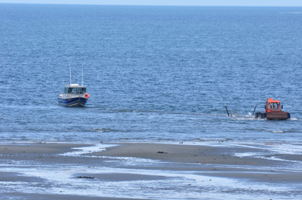 boat being towed by a tractor