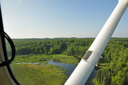 scenery taken out the closed window of the floatplane