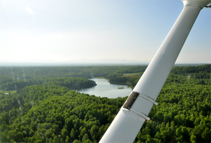 scenery taken out the closed window of the floatplane