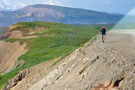 a hiker on the edge of a cliff