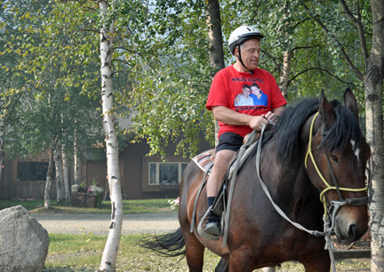 Lee Duuqette rides the horse in Alaska