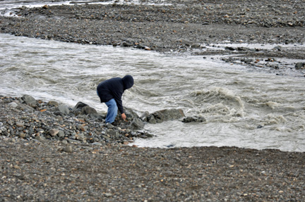 Alex plays with the rocks