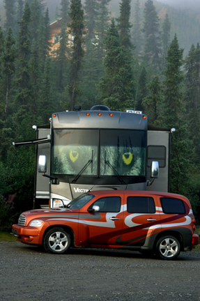 the RV and toad of the two RV Gypsies in their new yard