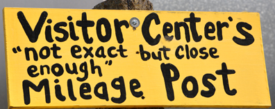 sign - visitor center mileage post