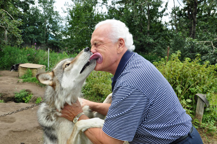 Lee gets a kiss from a wolf