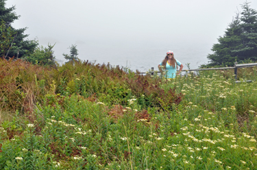 Karen Duquette in a field of flowers