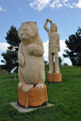 wooden carvings of a Koluskap and Beaver