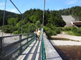 The two RV Gypsies on a suspension bridge over Big Salmon River