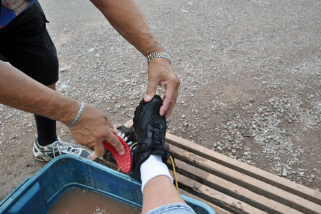 cleaning mud off the shoes